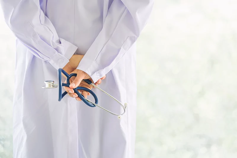 back-view-of-doctor-hand-hold-stethoscope-with-blu-2021-08-26-18-57-01-utc